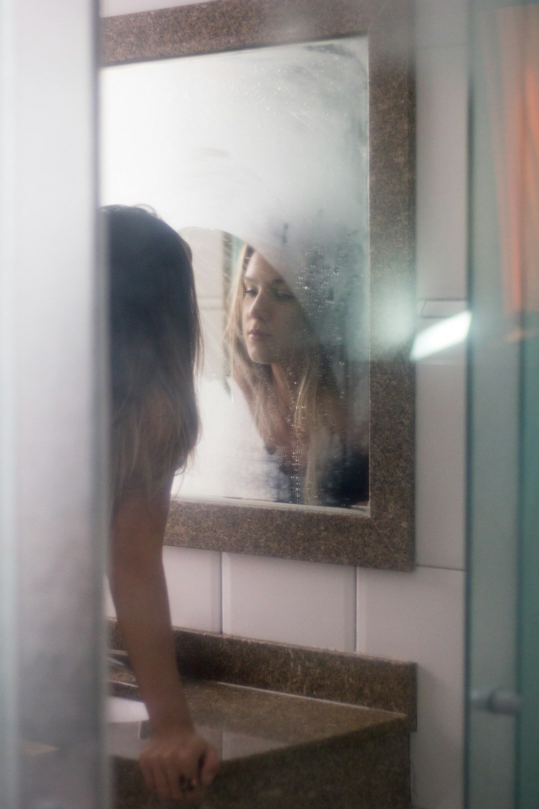 person looking in mirror confidently